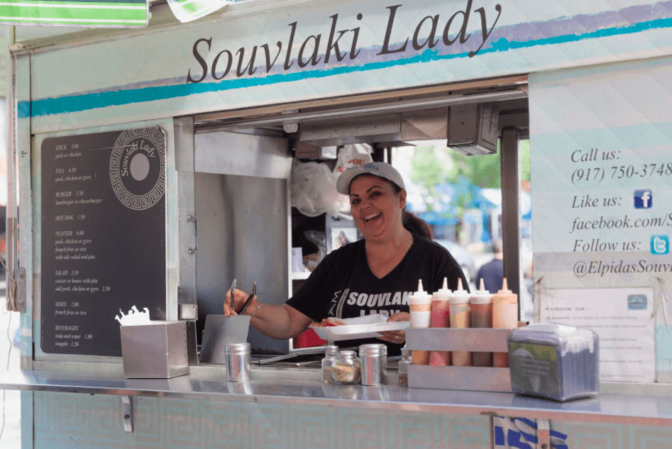 The Souvlaki Lady serving from the business’s food cart in Astoria